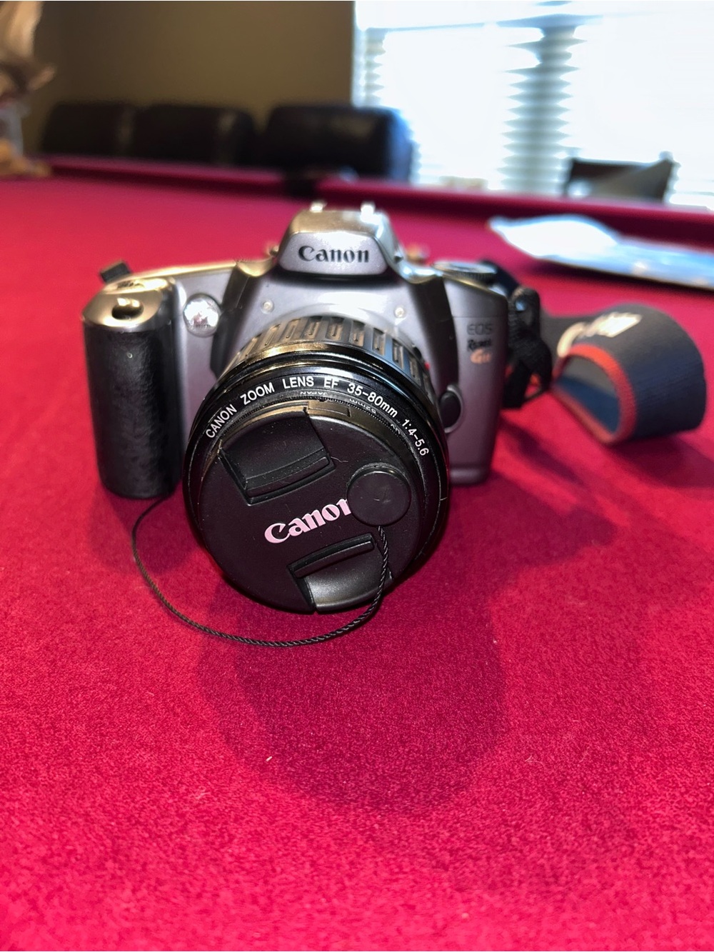 Canon Silver and Black DSLR with 35-80mm Lens